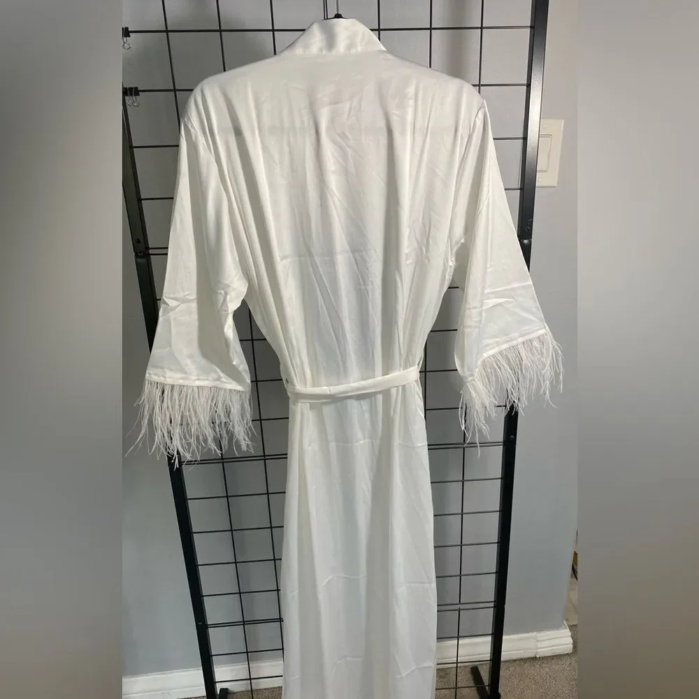 White robe with feather accent on sleeves NWOT